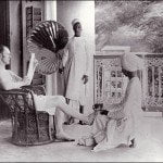 A British man gets a pedicure from an Indian servant.