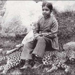 The daughter of an Indian maharajah seated on a panther she shot, sometime during 1920s.